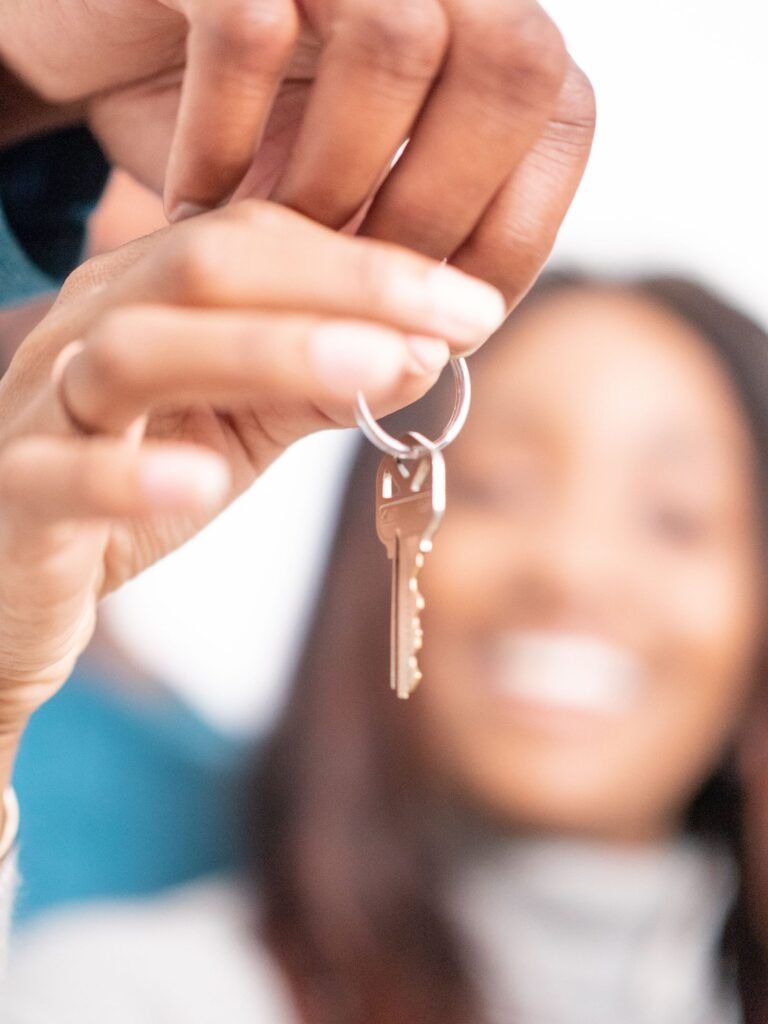 Person holding house keys — free emergency rent help in San Antonio can keep you housed