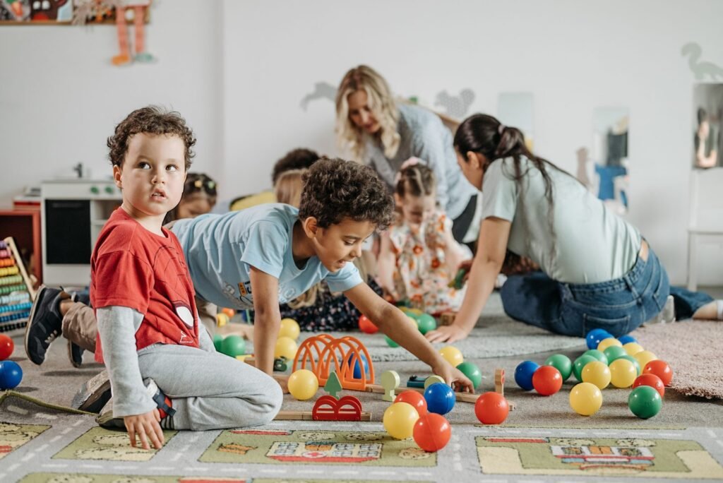 Boys playing on the floor at a San Antonio childcare center — free subsidies can cover the cost